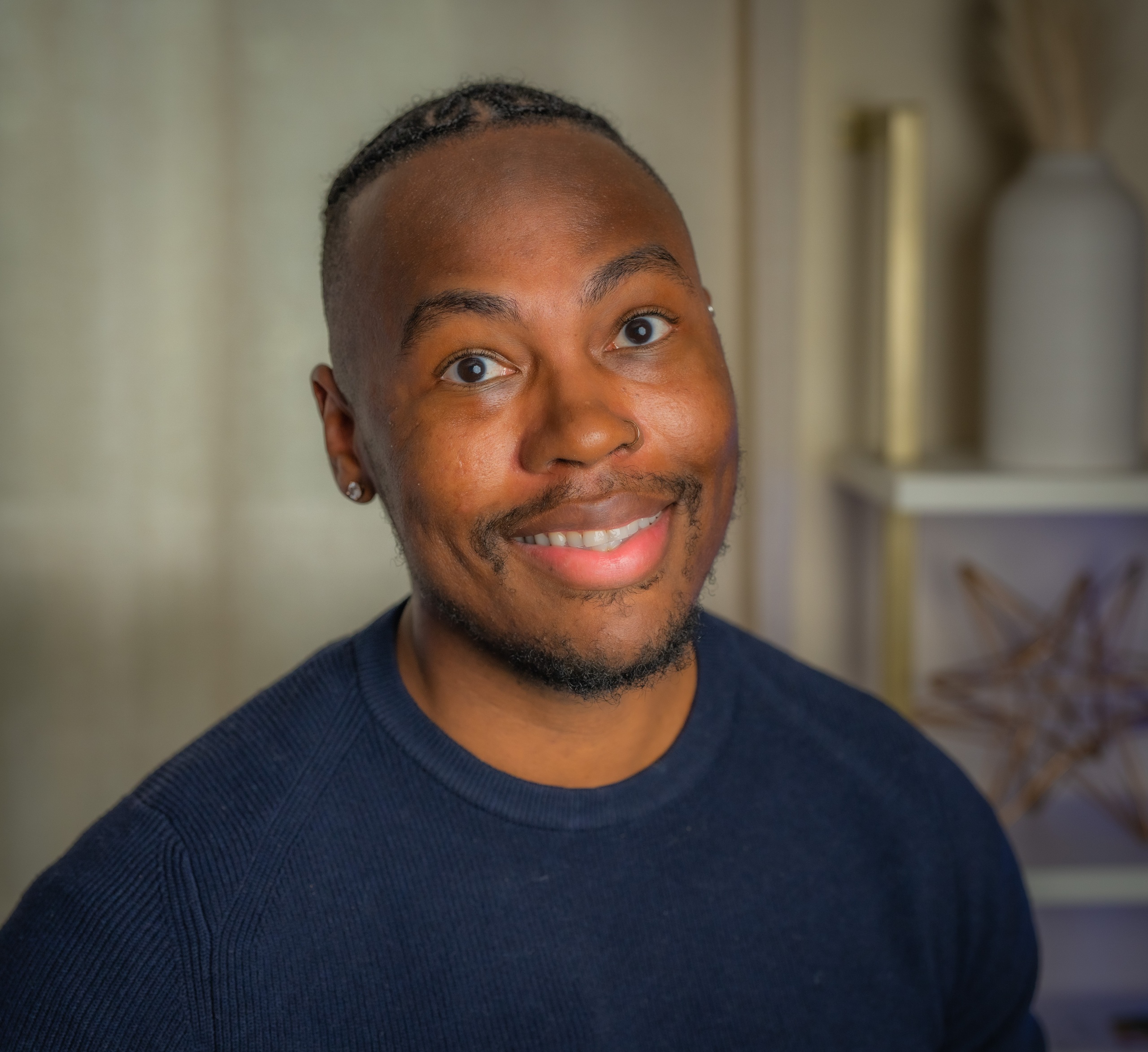 Headshot of Dorian Johnson wearing a blue shirt and smiling.